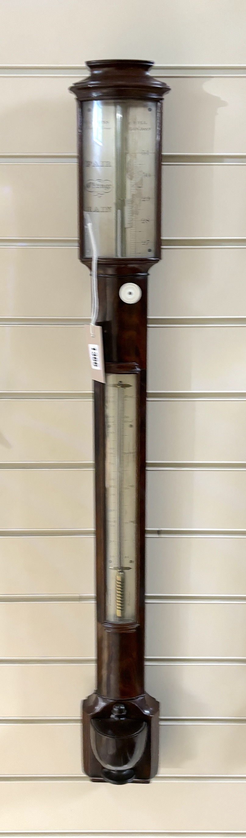 A 19th century mahogany stick barometer and thermometer by Watkins & Hill Charing Cross, London, with silvered scale, height 97cm